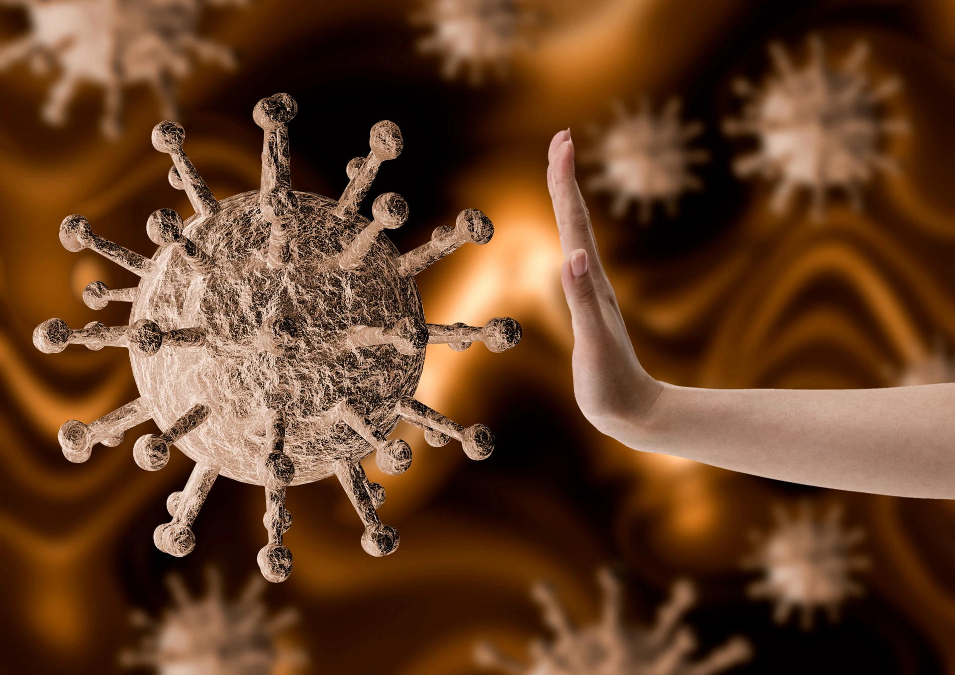 Hand som stoppar ett förstorat virus
