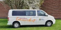 Vit bil med texten Gasverket