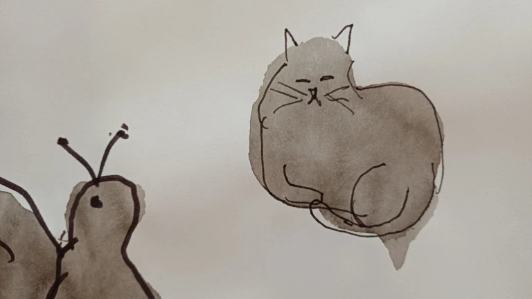 Liten katt ritad på ett papper